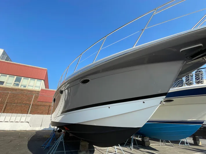  Yacht Photos Pics 2014 Formula 45 Yacht on stands, sleek design, gray hull, clear blue sky background.