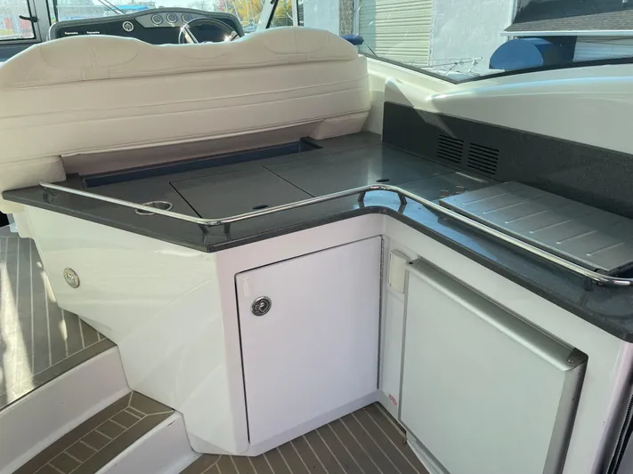  Yacht Photos Pics Interior of 2014 Formula 45 Yacht with sleek kitchenette and seating area.