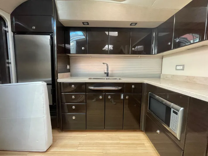  Yacht Photos Pics Luxurious kitchen interior of 2014 Formula 45 Yacht with modern appliances and sleek cabinetry.