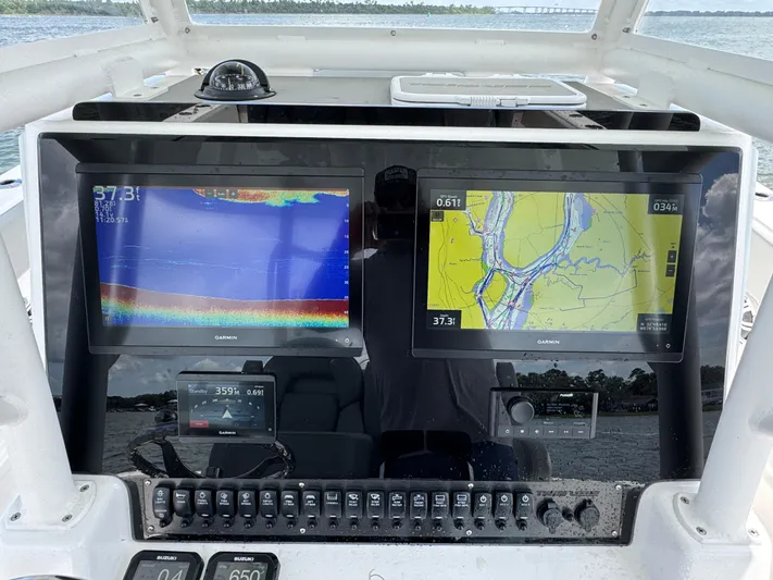 Katatak Yacht Photos Pics 2023 Twin Vee 280 GFX CC dashboard with Garmin navigation displays and controls.
