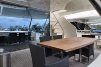 Luxurious 2010 Aicon 85 yacht deck with elegant dining area and modern seating.
