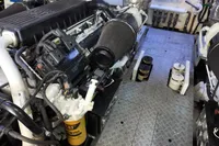 Engine room of 2010 Aicon 85 yacht, featuring dual engines and CAT filters.