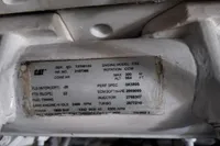 Engine specifications label on a CAT C32, showing technical details and serial numbers.