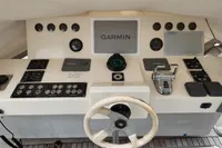 Control panel of a 2010 Aicon 85 yacht featuring Garmin navigation equipment.
