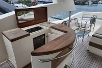Luxury yacht Aicon 85 (2010) deck with outdoor kitchen and seating area.