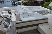 Luxury yacht Aicon 85 (2010) deck with jacuzzi and marina view.