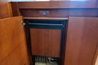 Wooden cabinet with built-in mini fridge on Aicon 85 yacht, 2010 model.