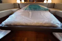 Luxurious Aicon 85 yacht interior with a spacious bed, 2010 model.