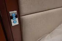 Interior detail of 2010 Aicon 85 yacht with modern control panel and upholstered wall.