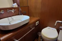 Luxurious bathroom in 2010 Aicon 85 yacht with modern sink and toilet.