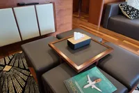 Luxurious Aicon 85 yacht interior with modern seating, wooden accents, and stylish decor.