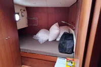 Cozy cabin interior of 2010 Aicon 85 yacht with bed and storage.