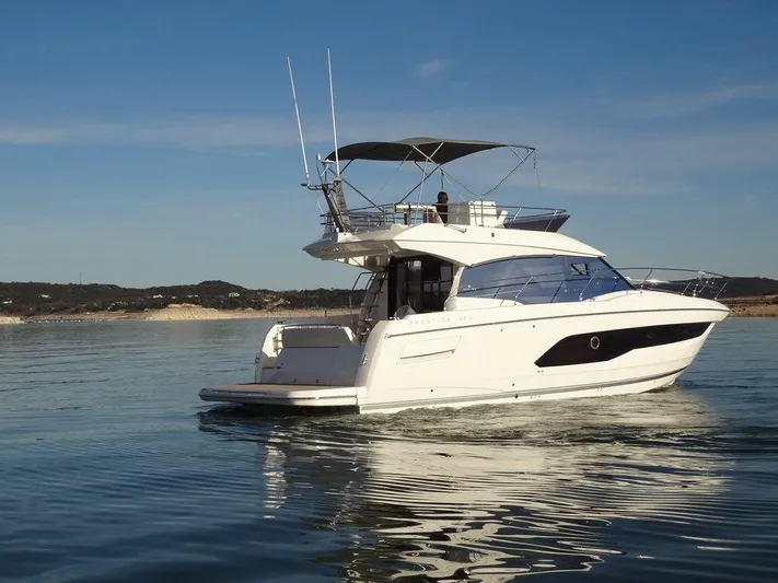  Yacht Photos Pics 2024 Prestige 420F yacht cruising on calm waters.