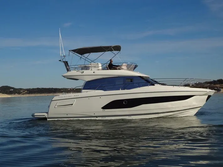  Yacht Photos Pics 2024 Prestige 420F yacht cruising on calm waters.