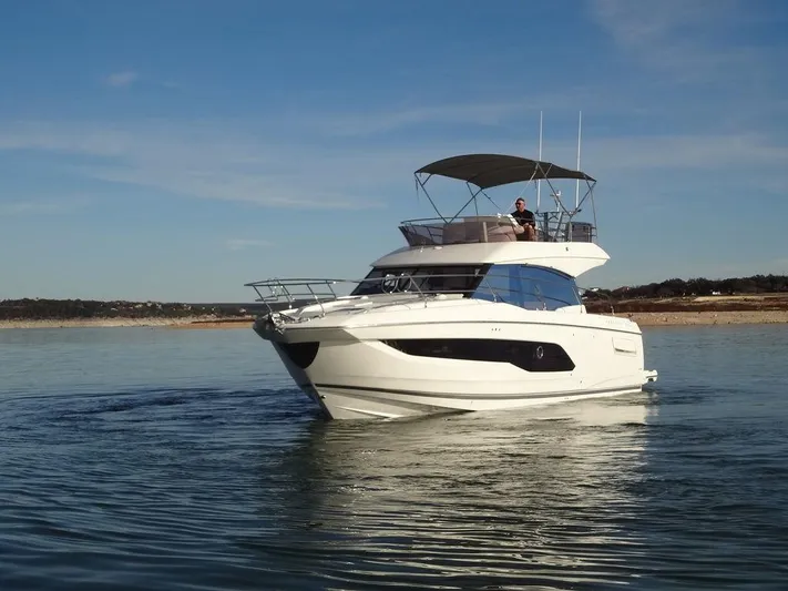  Yacht Photos Pics 2024 Prestige 420F yacht cruising on calm waters.