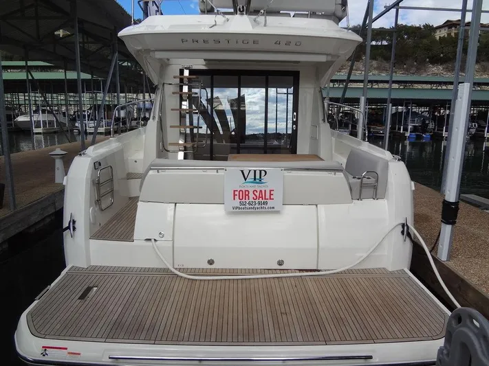  Yacht Photos Pics 2024 Prestige 420F yacht for sale at marina, rear view.