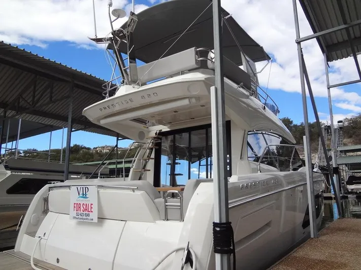  Yacht Photos Pics 2024 Prestige 420F yacht for sale at marina, rear view.