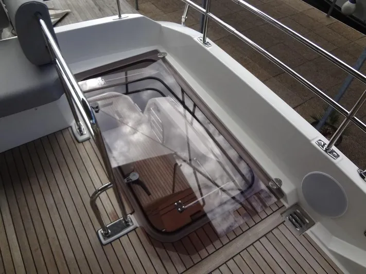  Yacht Photos Pics 2024 Prestige 420F yacht deck with glass hatch and stainless steel railings.