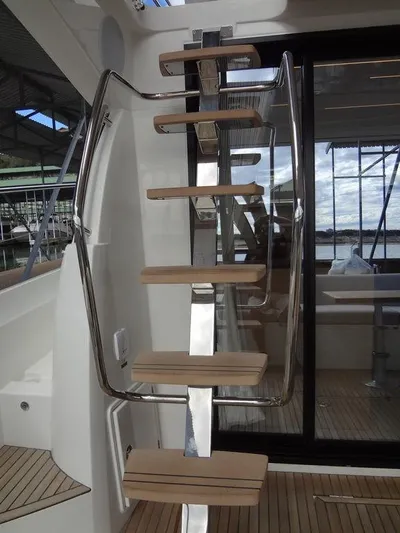  Yacht Photos Pics Prestige 420F 2024 yacht interior staircase with wooden steps and metal railings.