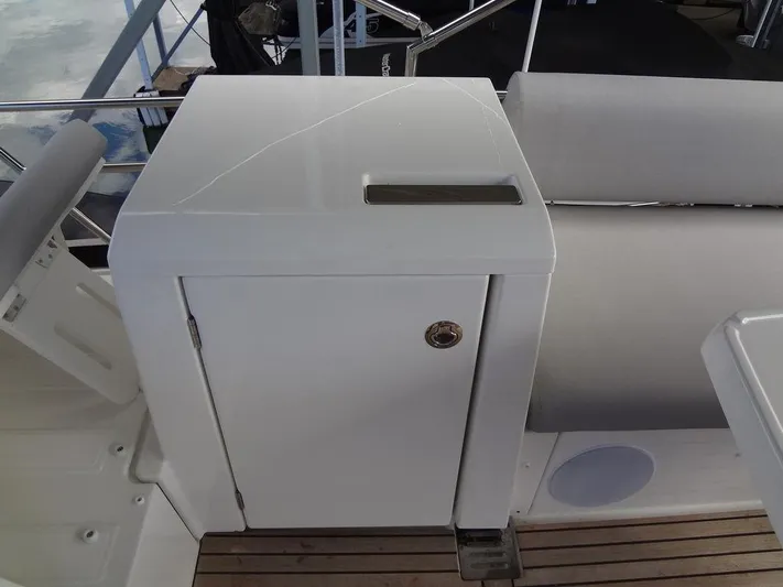  Yacht Photos Pics Prestige 420F 2024 yacht interior with white cabinet and cushioned seating.