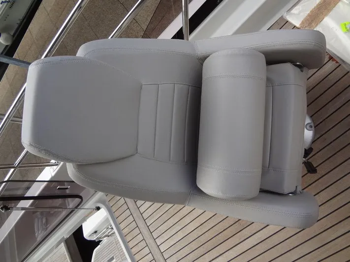  Yacht Photos Pics 2024 Prestige 420F boat's luxurious gray captain's chair on teak deck
