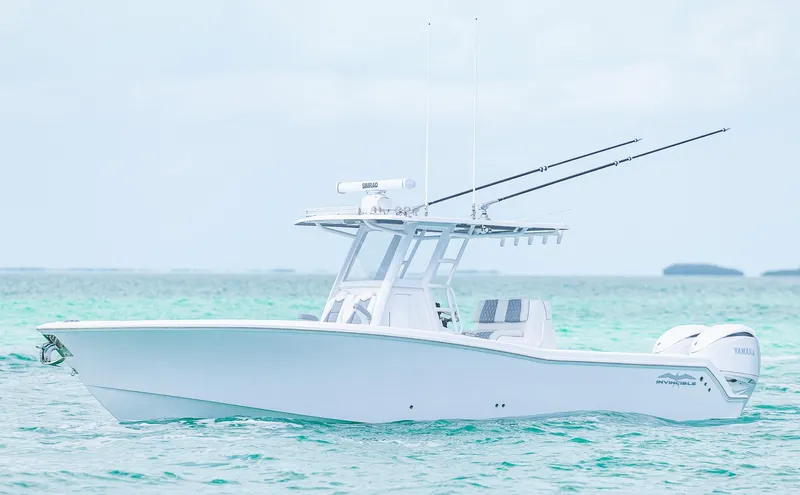  Yacht Photos Pics 2024 Invincible 33 Open Fisherman boat on clear blue water.