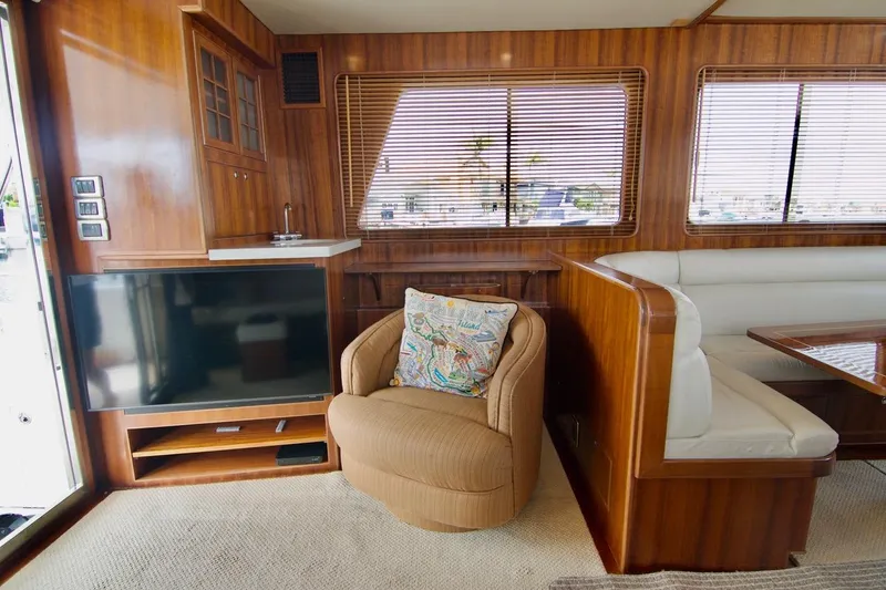 Pangea Yacht Photos Pics Luxurious 2007 Norseman 560 Sedan yacht interior with wood paneling and comfortable seating.