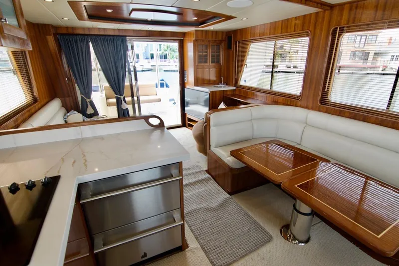 Pangea Yacht Photos Pics Luxurious interior of 2007 Norseman 560 Sedan yacht with elegant wood finishes and modern amenities.