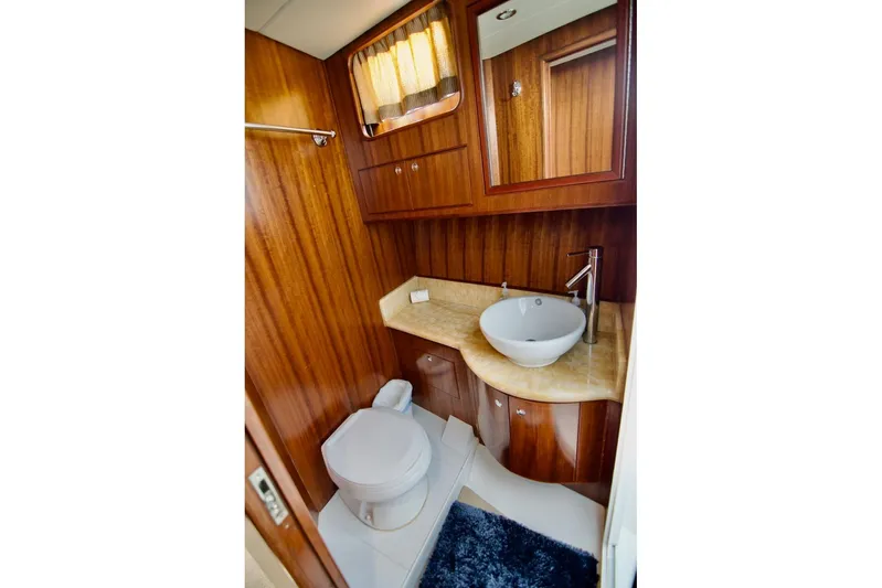 Pangea Yacht Photos Pics Luxurious wooden bathroom interior in 2007 Norseman 560 Sedan yacht.