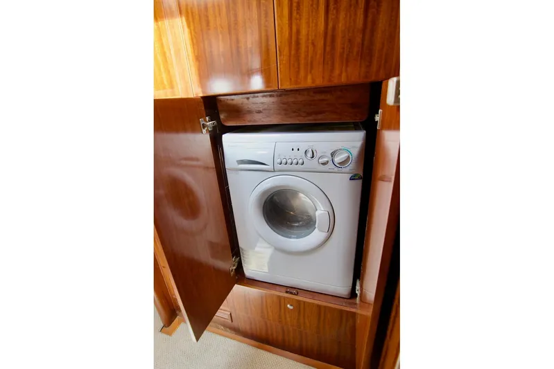 Pangea Yacht Photos Pics Washing machine inside wooden cabinet on 2007 Norseman 560 Sedan yacht.