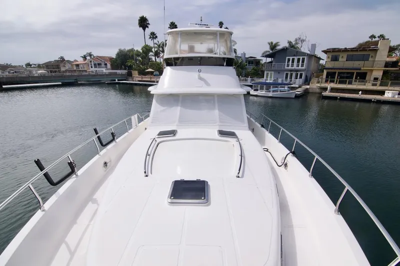 Pangea Yacht Photos Pics 2007 Norseman 560 Sedan yacht docked in a scenic waterfront neighborhood.