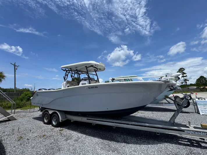  Yacht Photos Pics 2016 Sea Fox 288 Commander boat on trailer under clear blue sky.