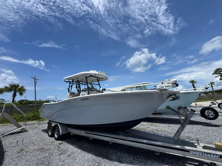  Yacht Photos Pics 2016 Sea Fox 288 Commander boat on trailer under blue sky.