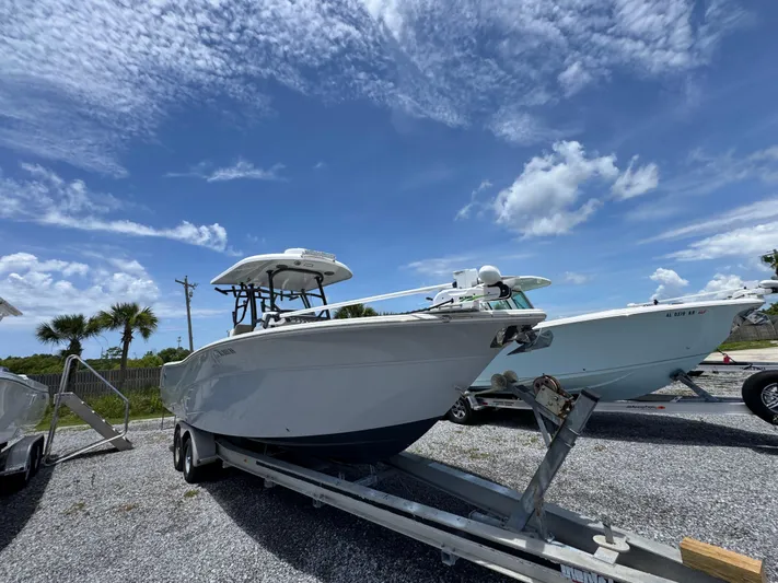  Yacht Photos Pics 2016 Sea Fox 288 Commander boat on trailer under blue sky.