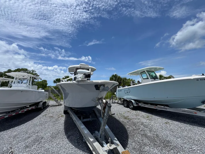  Yacht Photos Pics 2016 Sea Fox 288 Commander boat on trailer under a clear blue sky.