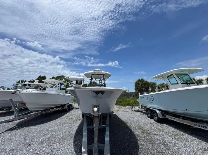  Yacht Photos Pics 2016 Sea Fox 288 Commander boat on trailer under blue sky.