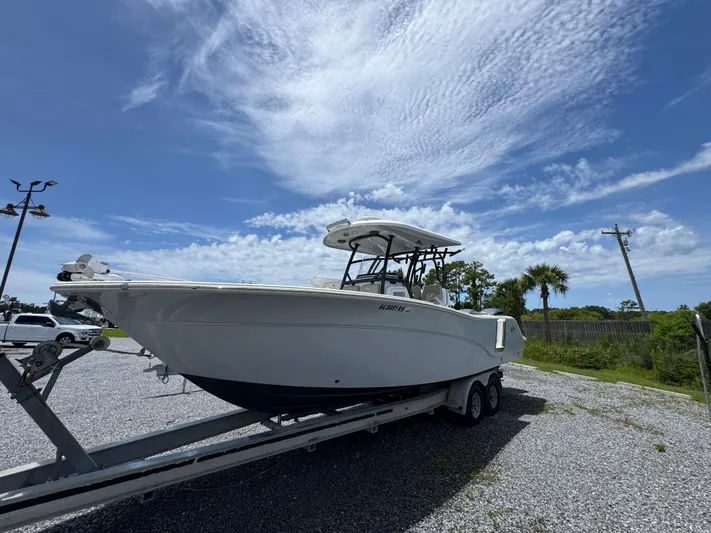  Yacht Photos Pics 2016 Sea Fox 288 Commander boat on trailer under a partly cloudy sky.