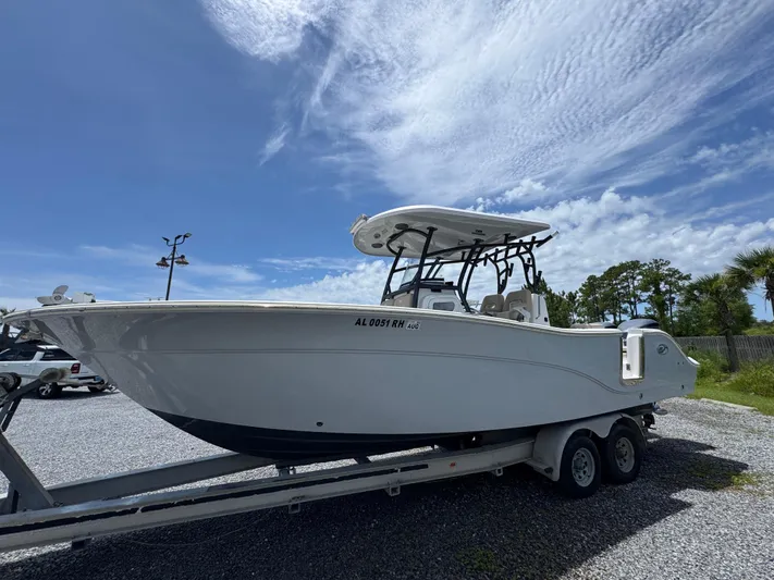  Yacht Photos Pics 2016 Sea Fox 288 Commander boat on trailer under clear blue sky.