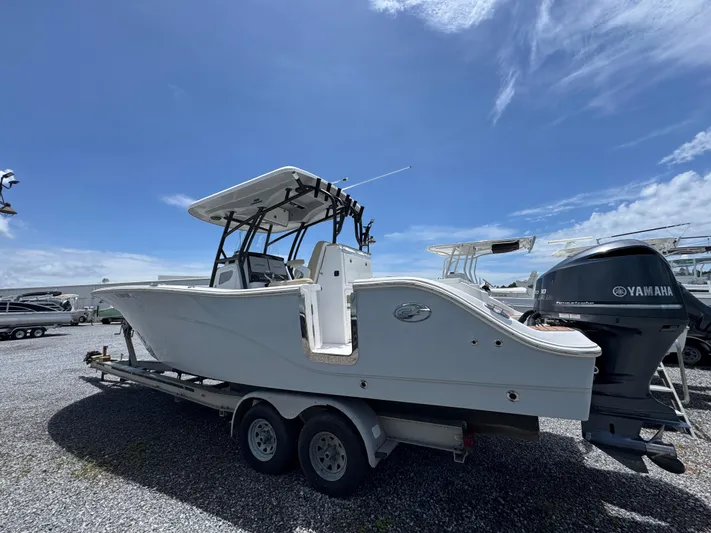  Yacht Photos Pics 2016 Sea Fox 288 Commander boat on trailer under clear blue sky.
