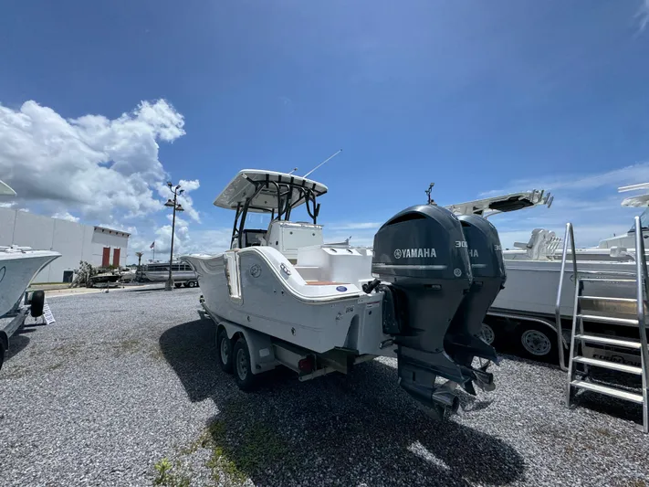  Yacht Photos Pics 2016 Sea Fox 288 Commander boat with Yamaha engines, parked outdoors under a clear blue sky.