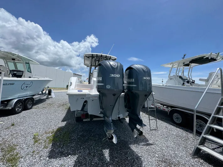 Yacht Photos Pics 2016 Sea Fox 288 Commander boat with twin Yamaha 300 engines, parked outdoors.