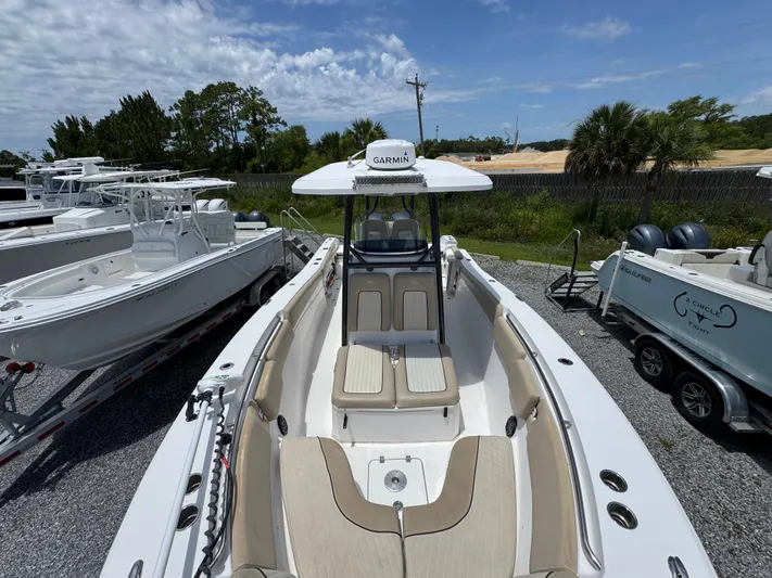 Yacht Photos Pics 2016 Sea Fox 288 Commander boat with Garmin equipment, docked under a partly cloudy sky.