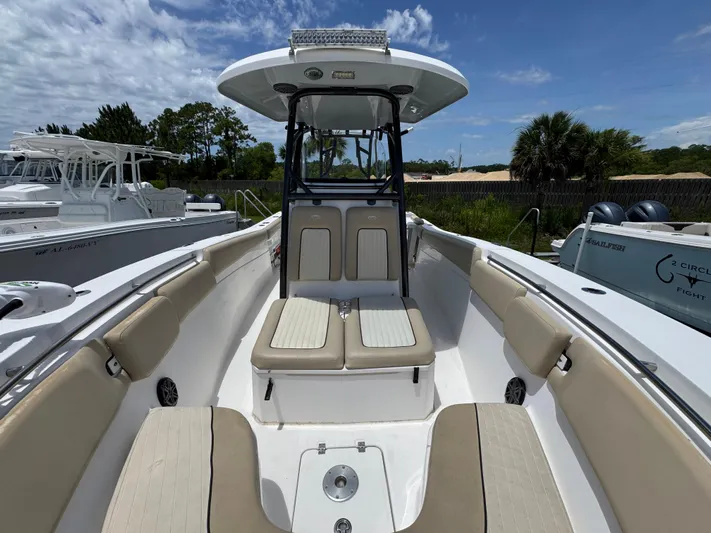  Yacht Photos Pics 2016 Sea Fox 288 Commander boat interior with seating and console, under a clear blue sky.