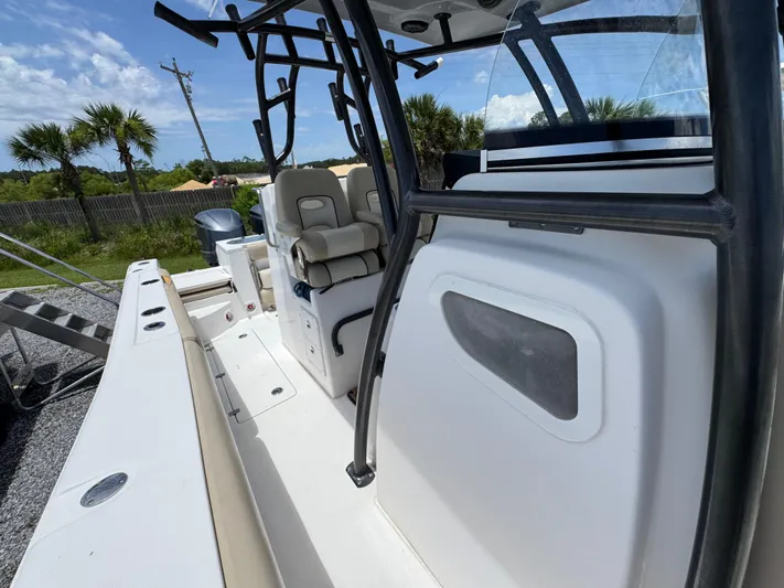  Yacht Photos Pics 2016 Sea Fox 288 Commander boat interior with seating and console, under a clear blue sky.
