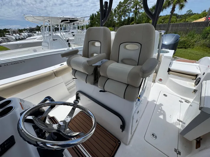  Yacht Photos Pics 2016 Sea Fox 288 Commander boat interior with dual captain's chairs and steering wheel.