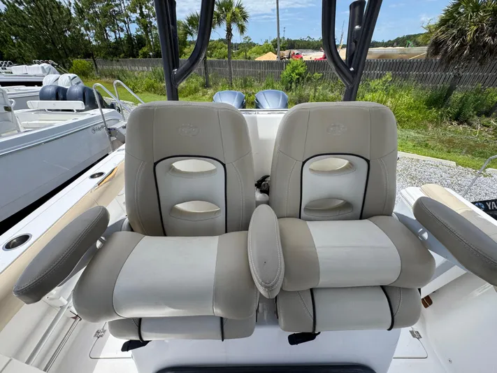  Yacht Photos Pics 2016 Sea Fox 288 Commander boat seats with armrests, set against a marina backdrop.