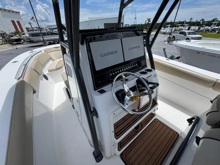  Yacht Photos Pics 2016 Sea Fox 288 Commander boat cockpit with dual Garmin displays and steering wheel.