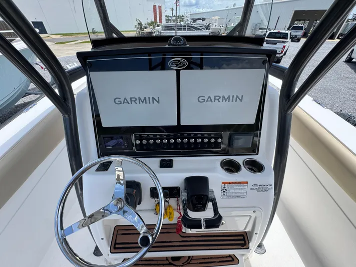  Yacht Photos Pics 2016 Sea Fox 288 Commander helm with dual Garmin displays and steering wheel.