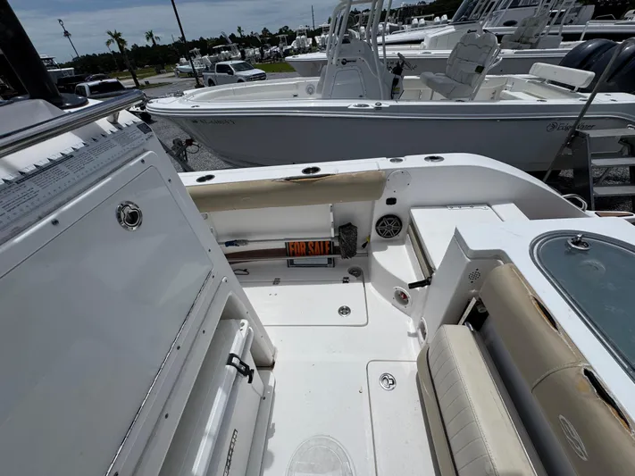 Yacht Photos Pics 2016 Sea Fox 288 Commander boat interior with seating and storage, displayed at a marina.