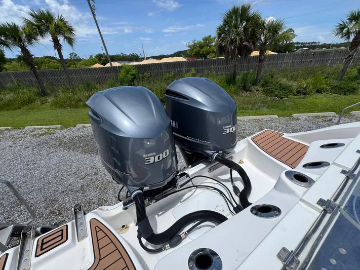  Yacht Photos Pics Twin Yamaha 300 engines on a 2016 Sea Fox 288 Commander boat, parked outdoors.
